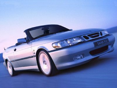 Front angled view of a silver convertible with distinctive grille and headlights