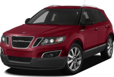 Red SUV front side view with chrome grille and stylish headlights