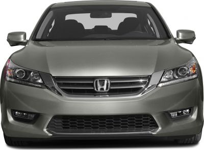 Front view with sleek headlights and chrome-accented grille