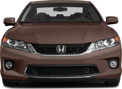 Front view of a coupe with grille, headlights, and fog lights
