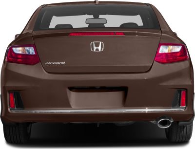 Rear view showing tail lights, emblem, and exhaust of a coupe
