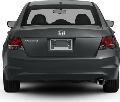 Rear view with taillights, license plate mount, and single exhaust pipe.