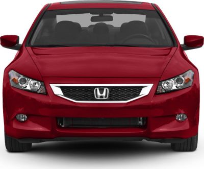 Front view showing headlights, grille, and bumper of a red coupe