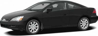 Sleek side view of mid-2000s coupe with alloy wheels