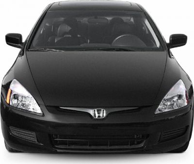 Front view of a sleek black coupe with clear headlights and smooth aerodynamic design