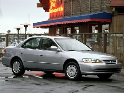 Silver mid-size sedan with smooth body lines and rounded headlights.