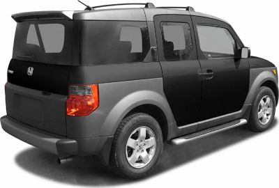 Rear side profile of a boxy SUV with rear spoiler and side step