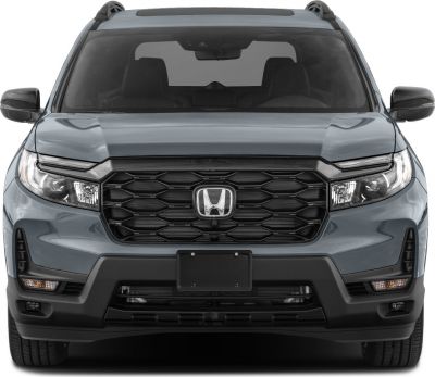Front view with hexagonal black grille and sleek headlights