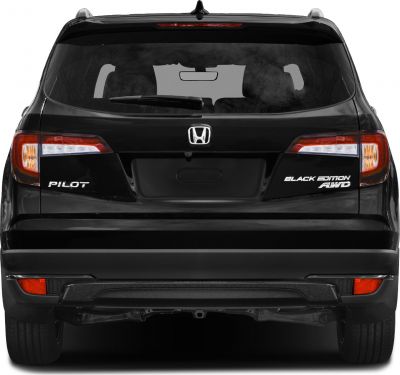 Rear view of a black SUV with taillights and badges.