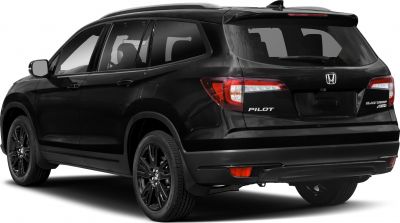 Rear and side view of SUV with black wheels, taillights, and rear spoiler