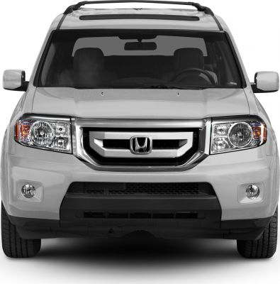 Front view with grille, headlights, and fog lights
