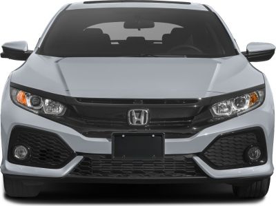 Front view with headlights, grille, and fog lights