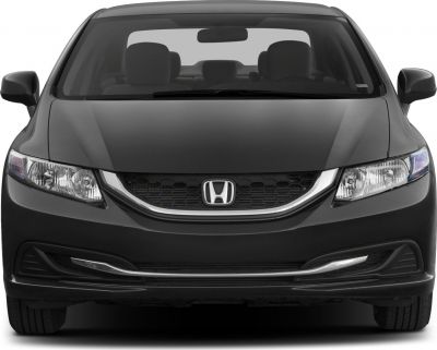 Front view of sedan with honeycomb grille and sharp headlights