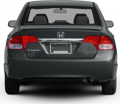 Rear view of a sedan with distinctive tail lights and chrome trim