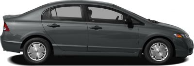 Sleek side profile of a compact four-door sedan with distinctive rim design