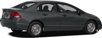 Side view of sedan with classic hubcaps and four doors