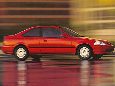 Sleek 1996 coupe side profile with two doors and compact design.