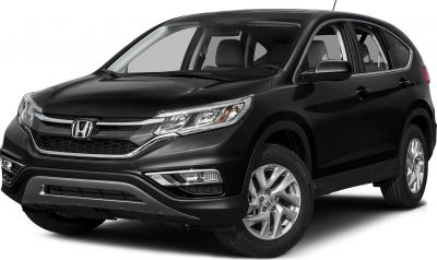 Front end with grille, headlights, and alloy wheels