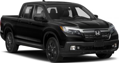 Black pickup truck front-side with distinct grille and headlight