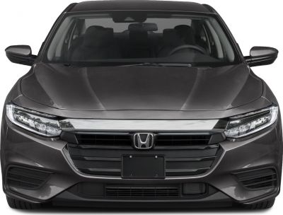 Front view with sharp LED headlights and prominent grille