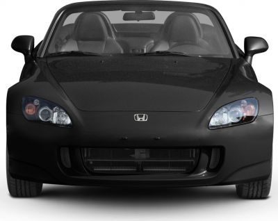 Front view with headlights and grille of a black sports roadster