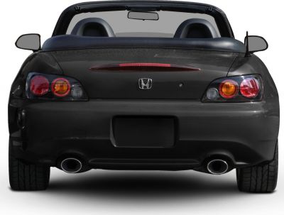 Rear view of convertible roadster with dual exhausts and distinct taillights