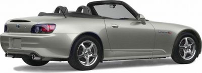 Rear side view of a convertible with dual exhaust and distinct taillights