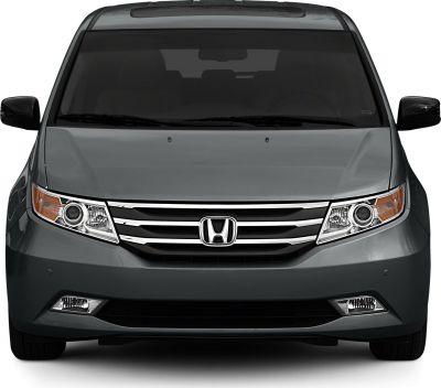 Minivan front with projector headlights and chrome grille