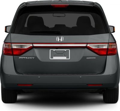 Rear view of minivan with distinctive taillights and badges