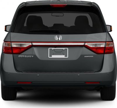 Rear view of minivan with horizontal taillights and Touring badge