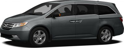Side profile of minivan with sliding doors and alloy wheels