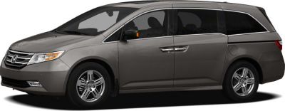Side profile of a minivan with sliding door and alloy wheels