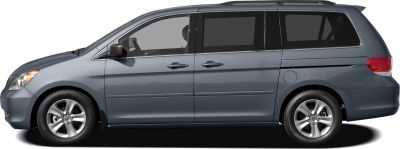 Side profile of a minivan with alloy wheels and sliding doors