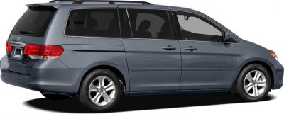 Side profile of minivan with sliding door and alloy wheels