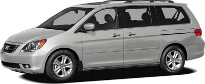Side profile of a silver minivan with four doors and alloy wheels