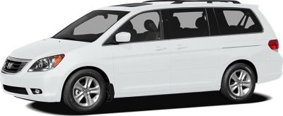White minivan front side profile with alloy wheels and sliding door