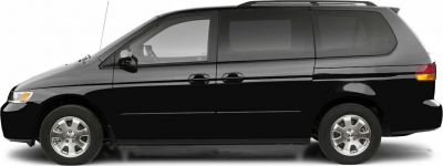 Side profile of a black minivan with sliding doors and alloy wheels.