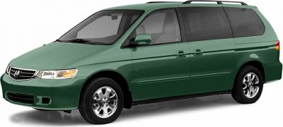 Green minivan with sliding rear doors and classic 1999 design.
