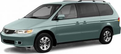 Minivan exterior front-side view showcasing body shape and design.