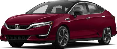 Front-side view of sleek red fuel cell sedan with LED headlights and aerodynamic design.