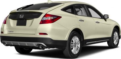 Rear 3-4 view showing dual exhaust and distinctive taillights