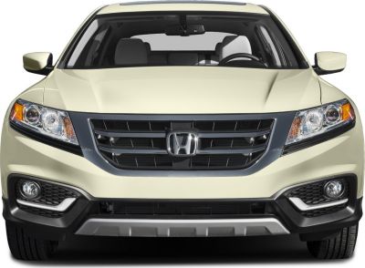 Front view with grille, headlights, and fog lights