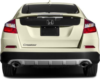 Rear view with distinctive tail lights and dual exhausts.