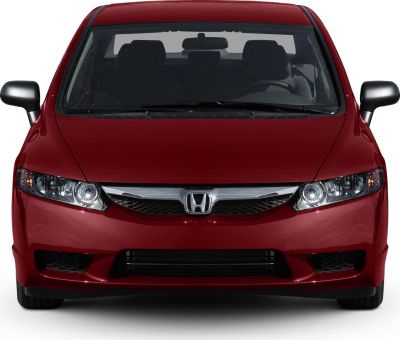 Sporty compact hatchback front with aggressive grille and LED headlights
