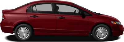 Side profile of red sedan with unique wheels
