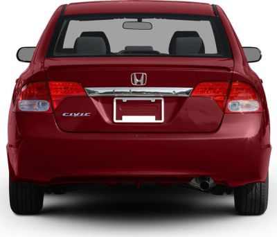 Rear view of a car with taillights and single exhaust pipe