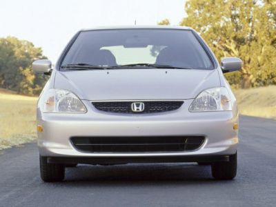 Front view with grille and headlights of a sporty hatchback.