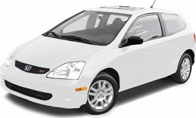 White compact hatchback with sunroof and sport rims front three-quarter view
