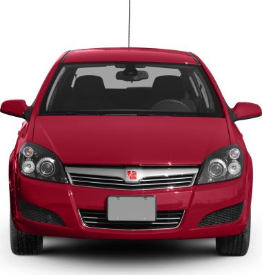 Red car front view with distinctive headlights and grille