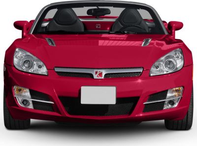Front view of convertible with dual round headlights and open roof